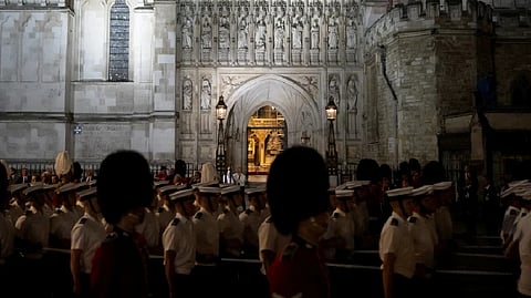 Guards and Royal Navy march past Westminster Abbey during a rehearsal for the funeral procession of Queen Elizabeth II in London.