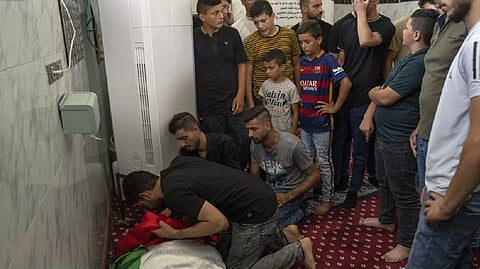 Mourners bid farewell to Salah Sawafta, 58, a Palestinian man who was shot to death as he returned from prayers in the West Bank city of Tubas.