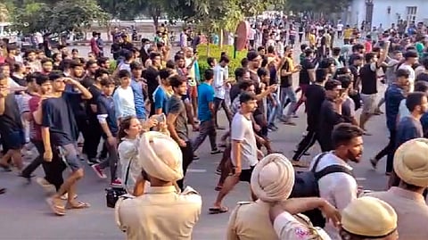 Students stage a protest over objectionable videos of several women students were allegedly recorded by a hosteller, at Chandigarh University