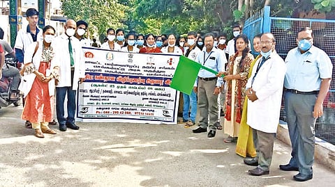 Doctors, nurses and officials take part in a rally