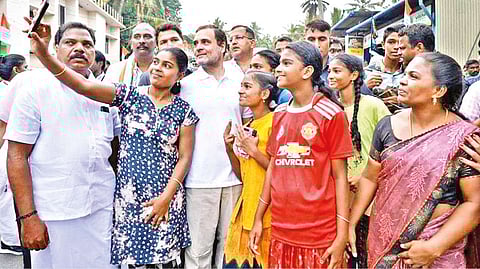 A girl taking a selfie with Rahul Gandhi