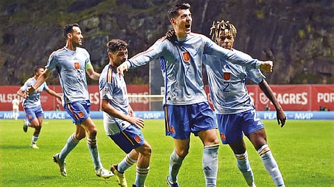 Spain?s forward Alvaro Morata celebrates with teammates after scoring