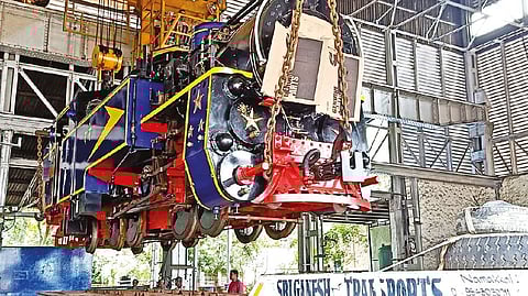 The HSD oil firing loco meant for Nilgiris Mountain Railway leaving the Golden Rock Workshop on a container lorry from Tiruchy on Wednesday.