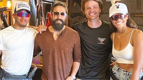 Yash with F1 champion Lewis Hamilton and Resident Evil actress Ella Balinska