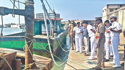 Navy Commodore Vishal Gupta and team inspecting the bullet-ridden boat in Nagapattinam harbour on Thursday.