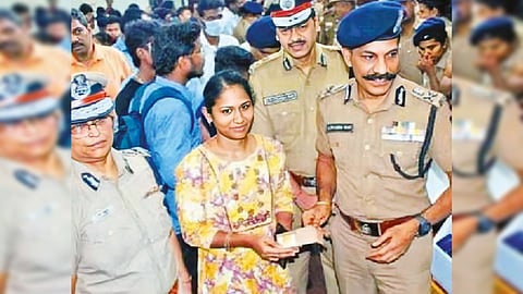 DGP C Sylendra Babu returning valuables retrieved by railway police to their original owners at a function in the city