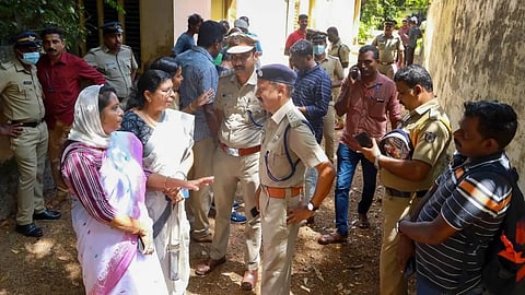 Police and locals at the place where two women were allegedly murdered and buried in a case of human sacrifice.