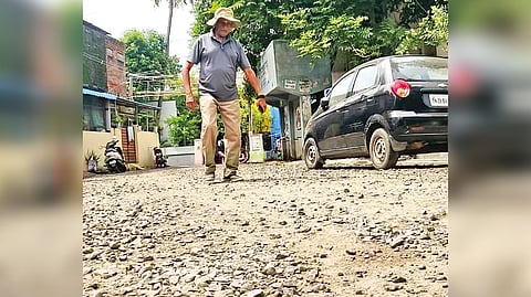 Gravel chips used to patch potholes found strewn all over the road in Chromepet
