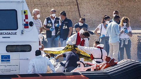 Bodies are disembarked on the tiny Sicilian island of Lampedusa, Italy, Oct. 21, 2022. More than 29,000 migrants have died trying to reach Europe since 2014, with 5,000 deaths in the last two years, the International Organization for Migration said in a report.