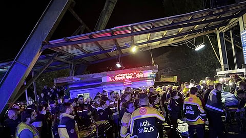 Medics and security personnel wait outside the coal mine after an explosion in Amasra in the northern Bartin province