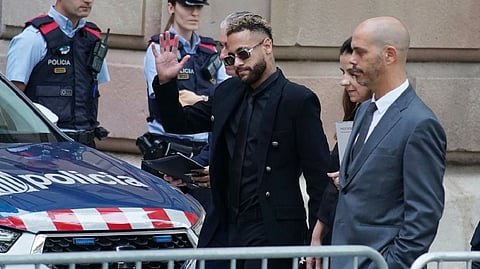Former FC Barcelona player Neymar who now plays for Paris Saint-Germain, centre, arrives at a court in Barcelona, Spain, Monday Oct. 17, 2022.