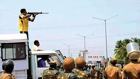 An officer targeting civilians during anti-Sterlite protests in 2018