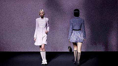 Models present creations by designer Virginie Viard as part of her Spring-Summer 2023 Women's ready-to-wear collection show for fashion house Chanel, during Paris Fashion Week in Paris