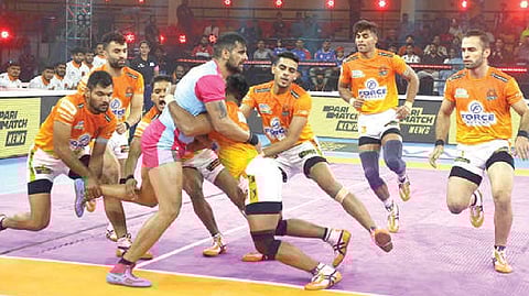 Jaipur?s Rahul Chaudhri is tackled by Puneri Paltan.