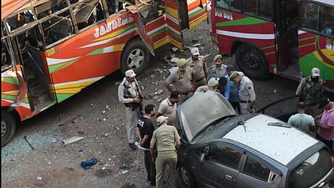Police inspect the site of one of the explosions