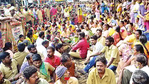 Contract conservancy workers staging protest in Coimbatore on Monday.