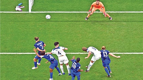 England forward Harry Kane heads the ball as USA?s goalkeeper Matt Turner looks on