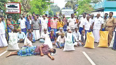 Farmers staging a road blockade in Tiruvaiyaru near Thanjavur on
Tuesday against the DPC staff