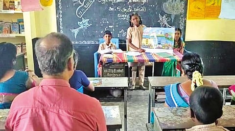 Mordana PU middle school teachers listening attentively to lessons being taken by students of Class 8 in the school near Gudiyattam on Thursday