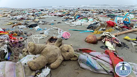 Plastic and other debris are seen on the shores of Marina Beach