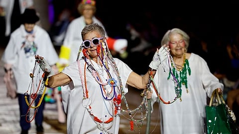 Models present creations by fashion school students of LISAA as part of a fashion show named "Another look at old age" organised by the Petits Freres des Pauvres Association, to promote a more inclusive stance on age, in Paris.
