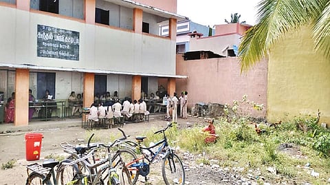 Students sitting outside the corridor