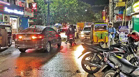 Bikes and autos parked on either side of Kamarajar Nedunchalai creating traffic logjam in Perungalathur.