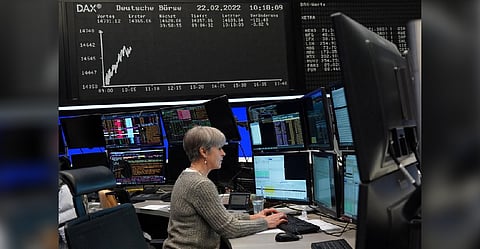 A trader works at the Frankfurt stock exchange in Frankfurt, Germany