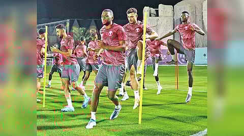 Qatar players go through the paces ahead of the opener