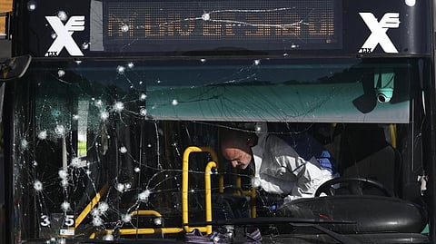 Israeli police inspect the scene of an explosion at a bus stop in Jerusalem, Wednesday, Nov. 23, 2022. Two blasts went off near bus stops in Jerusalem on Wednesday, injuring several people in what police said were suspected attacks by Palestinians.
