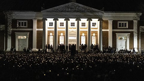 University of Virginia students participate in a vigil in response to shootings that happened on campus the night before in Charlottesville, Va.