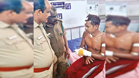 Forest officials enquiring injured anti-poaching watcher Bomman at hospital on Wednesday