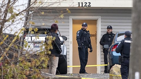 Officers investigate a homicide at an apartment complex south of the University of Idaho campus on Sunday.