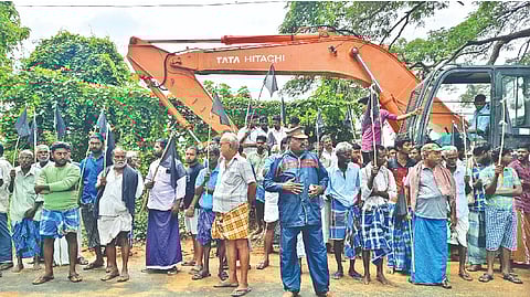 Farmers staging protest against by-pass road works in Tiruvaiyaru
on Wednesday