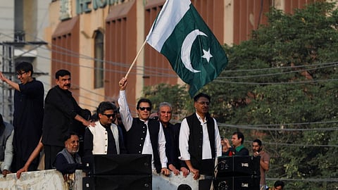 Pakistan's former prime minister Imran Khan waves the national flag