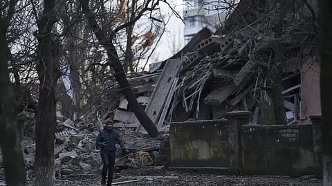 A man walks past a school building heavily damaged during a Russian attack in Kramatorsk, Donetsk region, Ukraine.