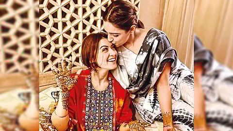 Hansika is seen beaming with joy while mehendi being applied to her hands