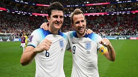 Harry Maguire, Harry Kane posing after the win
