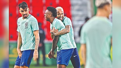 Vinicius Junior and Neymar share a light moment during Brazil training