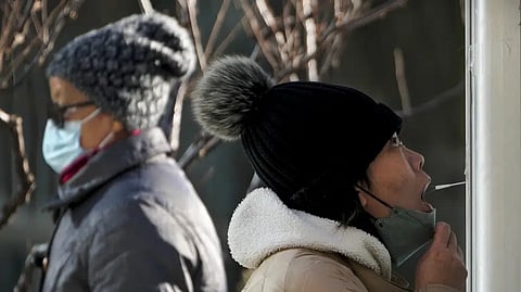 Covid-19 throat swab at a coronavirus testing site in Beijing