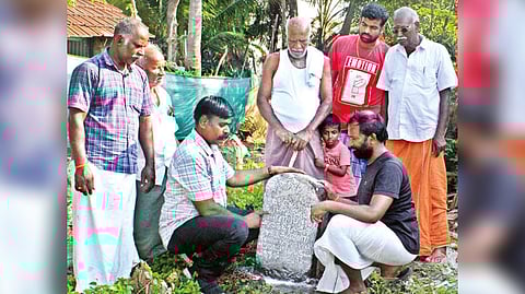 V Rajaguru with the stone inscription found in Thiruvadani in Ramanathapuram