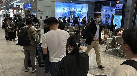 Passengers prepare to board a flight at the airport in north-central China's Jiangxi province.