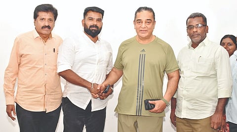 V Muniyasamy with MNM president Kamal Haasan on Sunday.
