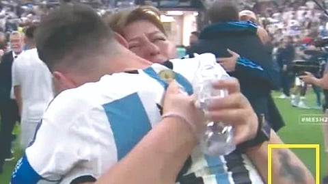 Woman embracing Messi after final, not his mom