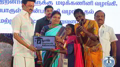 Stalin handing over laptop to a disabled person under the Naan Mudhalvan scheme.