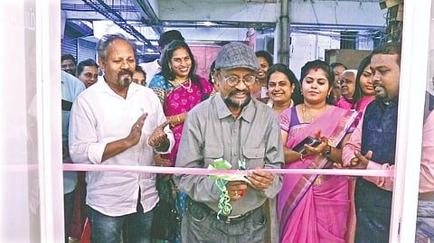 P Augustine inaugurating the show Left: Artist receiving the catalogue