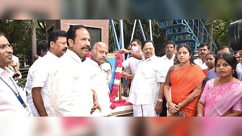 Duraimurugan playing floral tribute to a picture of BR Ambedkar at the Vellore Collectorate.