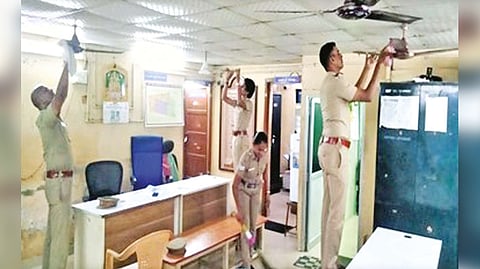 Cops cleaning the premises a police station