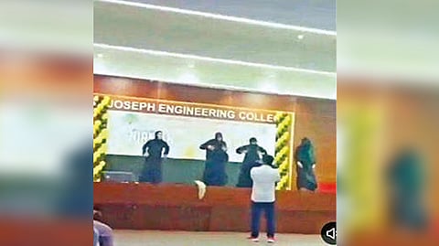 Students dancing in  burqa