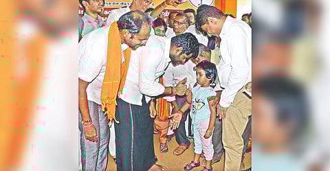 BJP state president K Annamalai greeting a child at a party function in Coimbatore on Wednesday